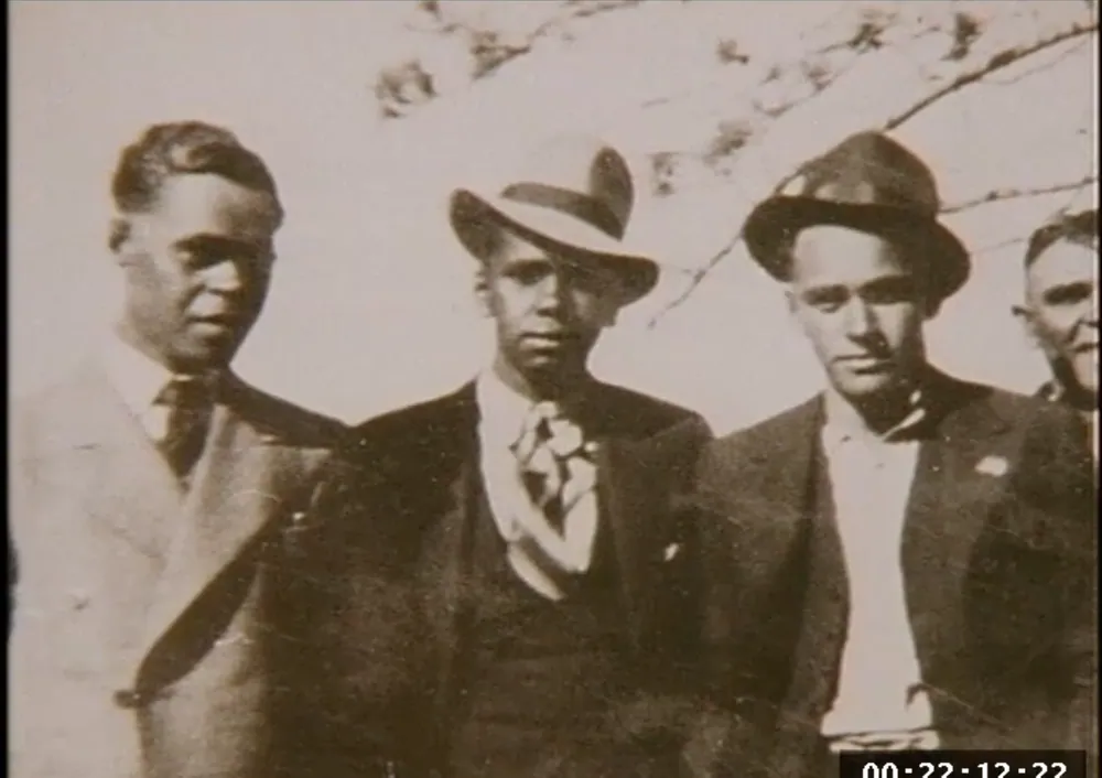 Three men, sepia archival photograph